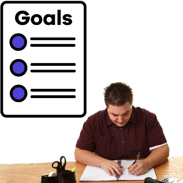 A person sitting at a desk and writing and a Goals document.